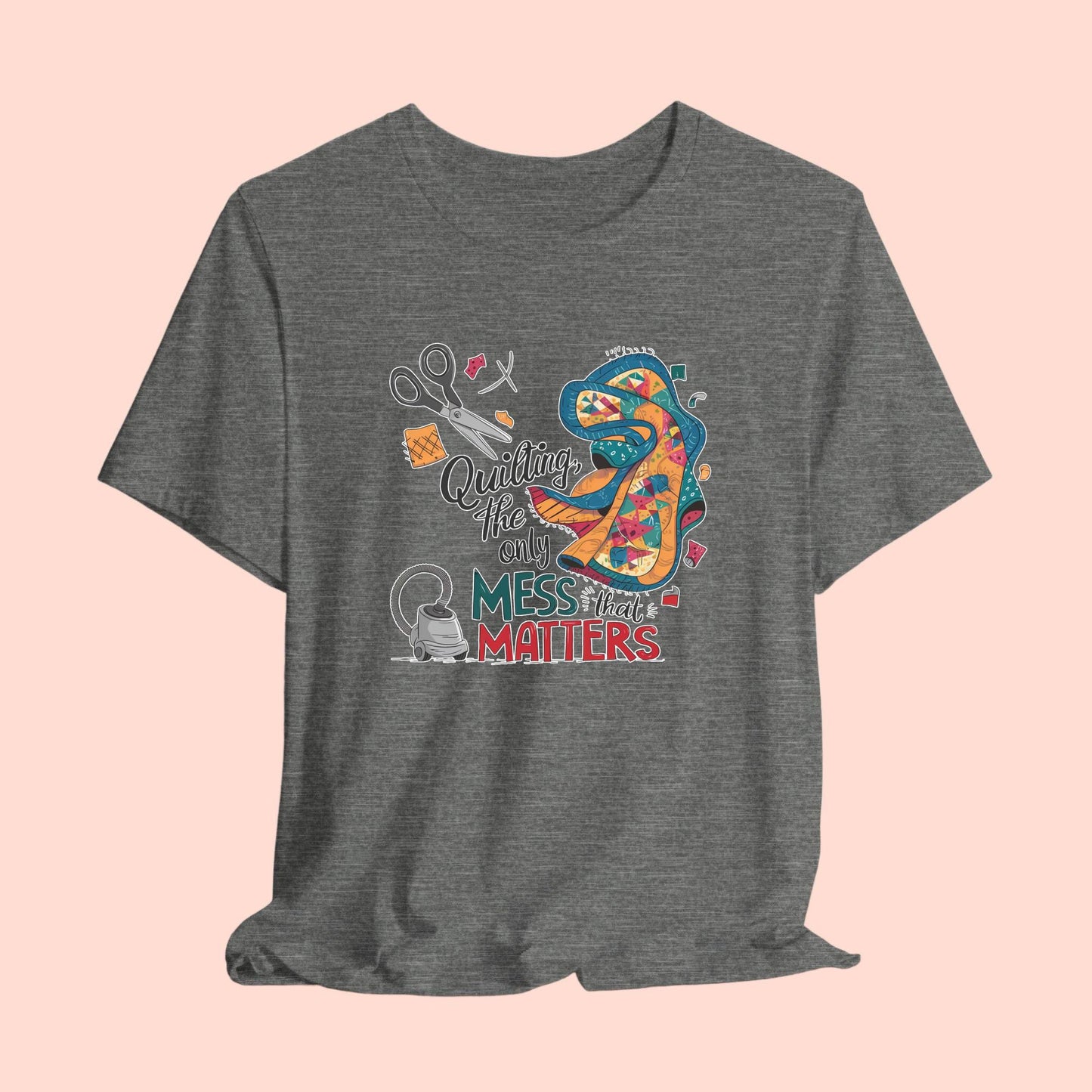 A fun T-Shirt with the phrase Quilting, the Only Mess that Matters and illustrations of fabric scraps, scissors, and a vacuum cleaner. Colorful quilt patterns swirl around the text, creating a playful and relatable design for quilting enthusiasts.