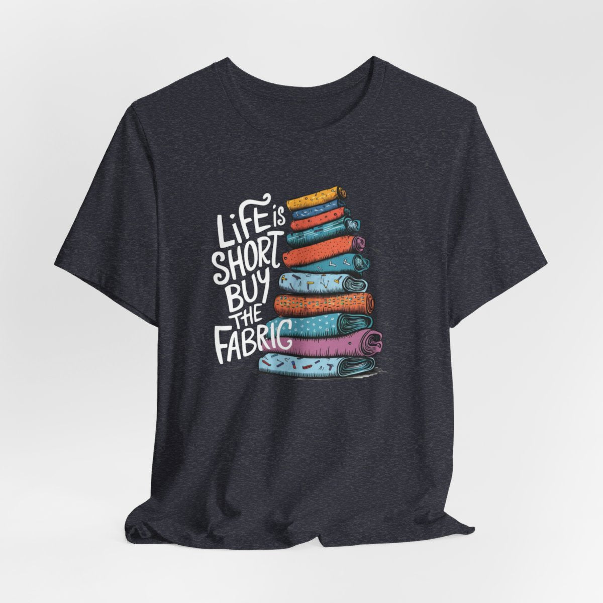 Assorted 'Life Is Short, Buy the Fabric' themed funny quilting t-shirts and gifts for quilters from the collection