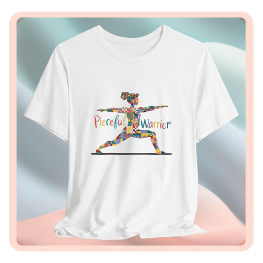 A Tee featuring a colorful patchwork silhouette of woman in yoga warrior pose. Text reads "Pieceful Warrior" in multicolored lettering.