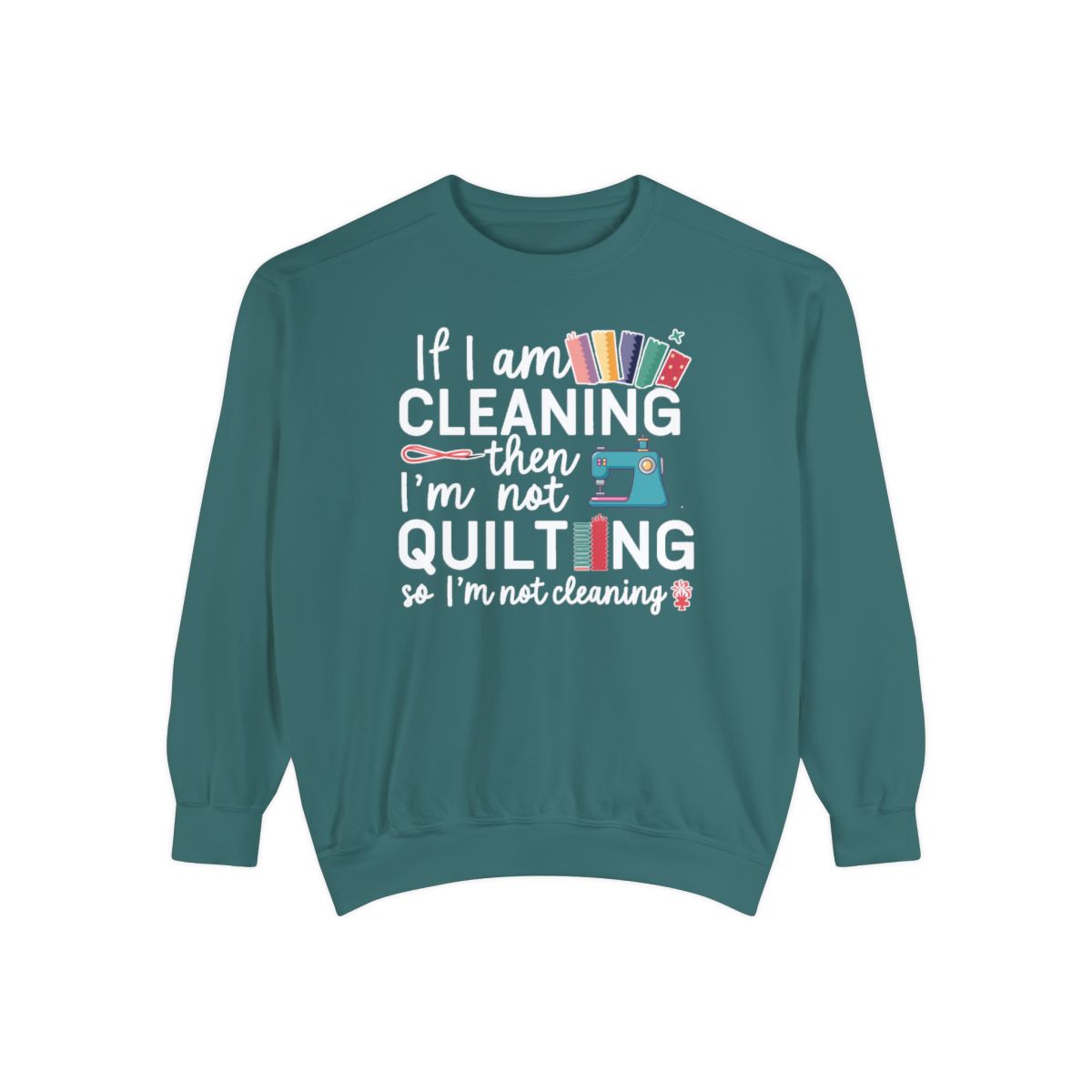 A Blue Spruce funny Sweatshirt with the phrase If I am Cleaning then I'm not Quilting in a bold and cheerful font with images of quilting icons and supplies