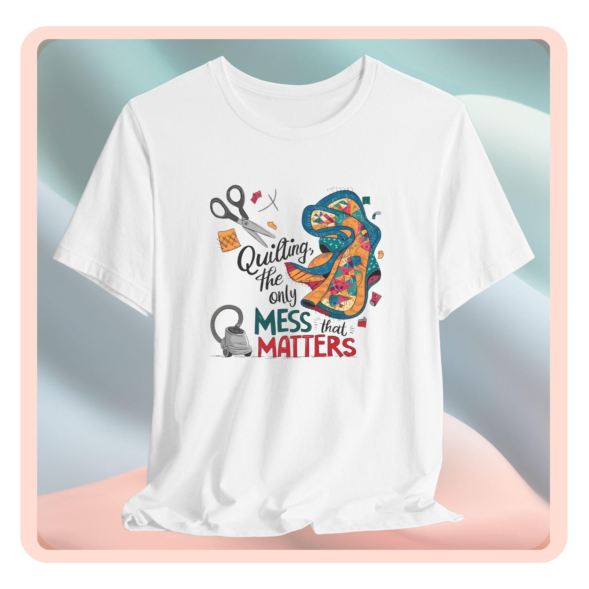 A fun T-Shirt with the phrase Quilting, the Only Mess that Matters and illustrations of fabric scraps, scissors, and a vacuum cleaner. Colorful quilt patterns swirl around the text, creating a playful and relatable design for quilting enthusiasts.