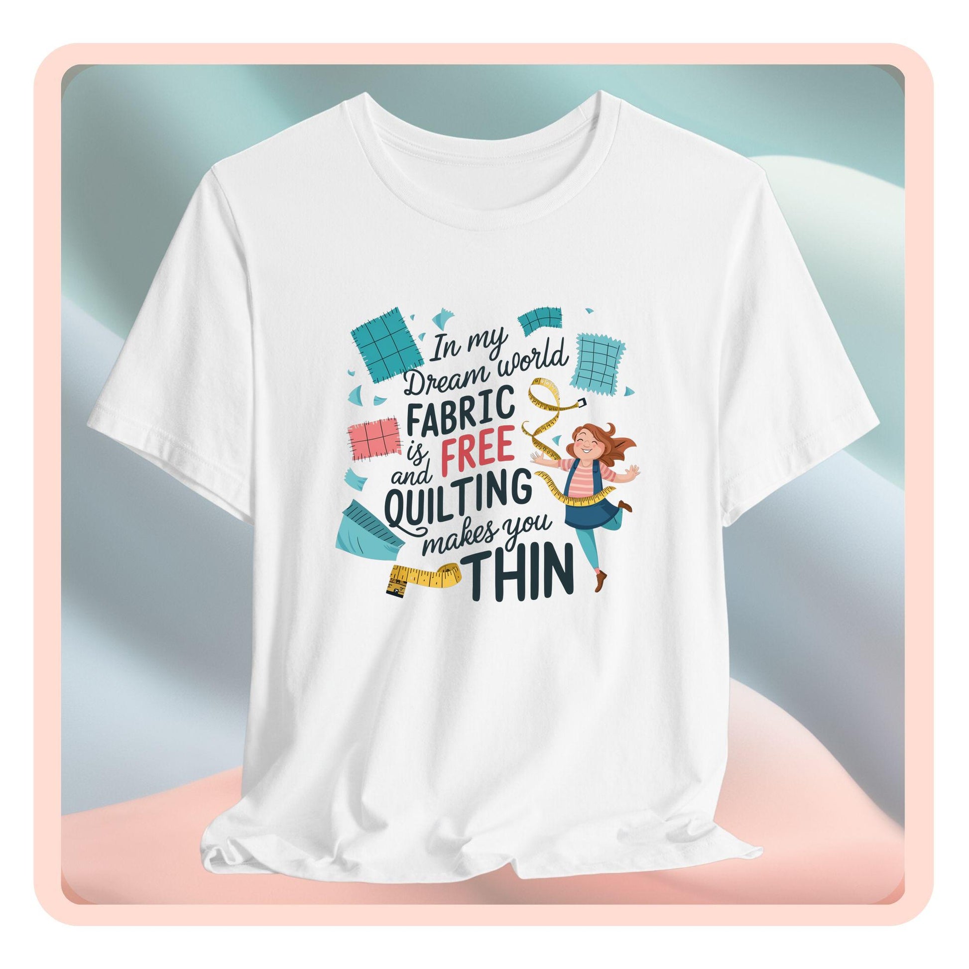 A funny quilting T-Shirt with the phrase Fabric is Free and Quilting Makes You Thin in a fun font with a cheerful quilter jumping for joy