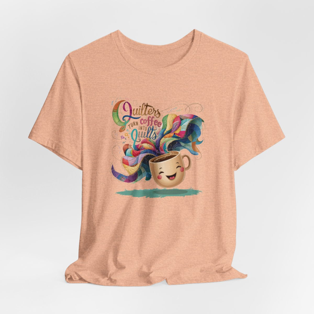 A Heather Peach funny quilting T-Shirt with the phrase Quilters Turn Coffee Into Quilts showing a fun coffee cup and quilting design