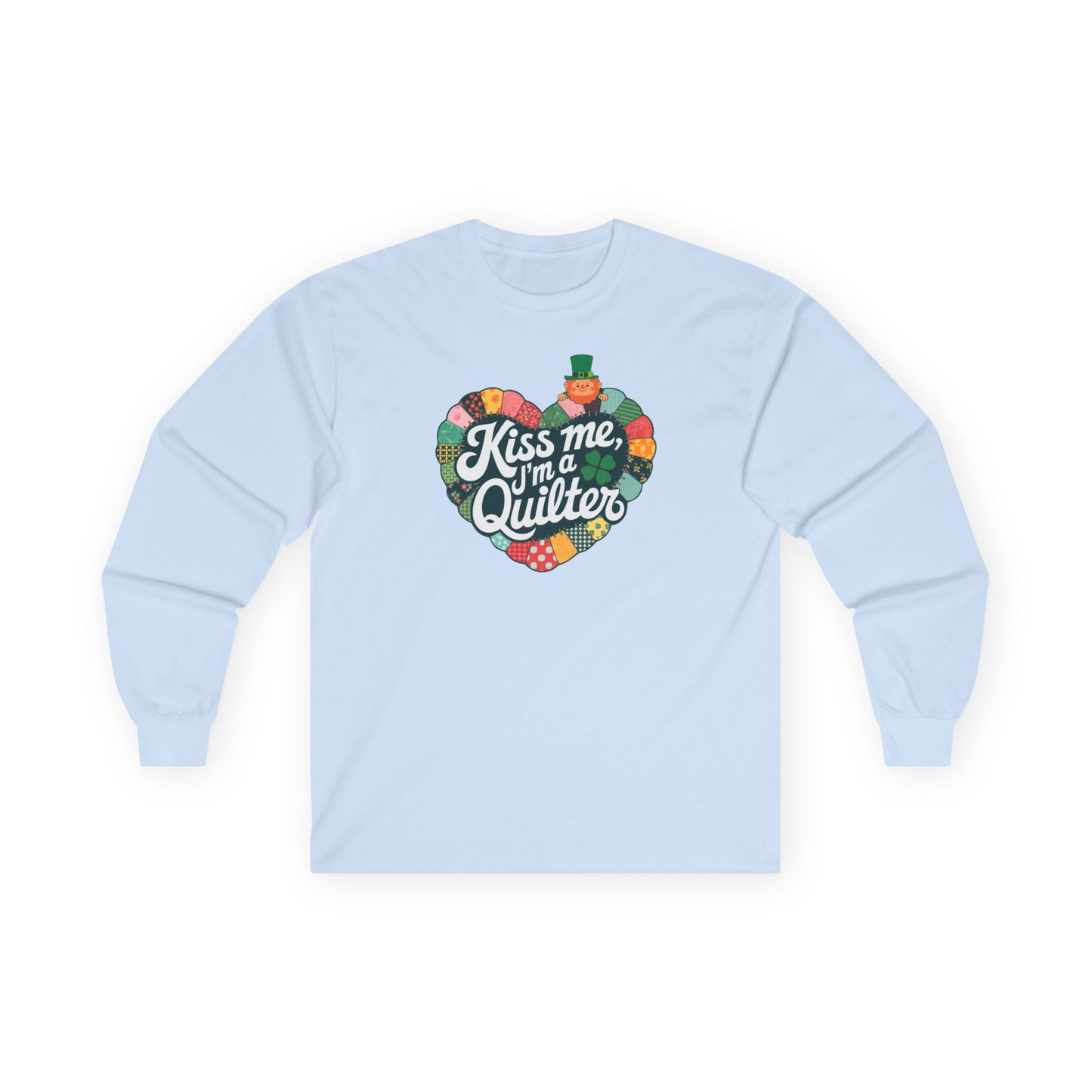 A Light Blue long-sleeve t-shirt featuring a heart-shaped patchwork quilt design with shamrocks, a leprechaun, and the phrase 'Kiss Me, I’m a Quilter,' perfect for St. Patrick’s Day quilting fun.