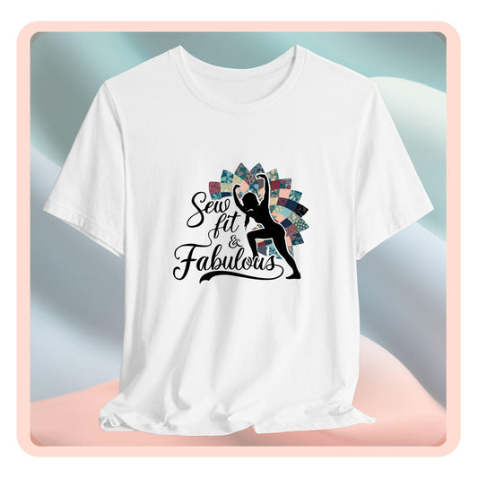 A T-Shirt featuring a black silhouette of woman with raised arms against colorful patchwork background. Text reads "Sew fit & Fabulous" in stylized script.