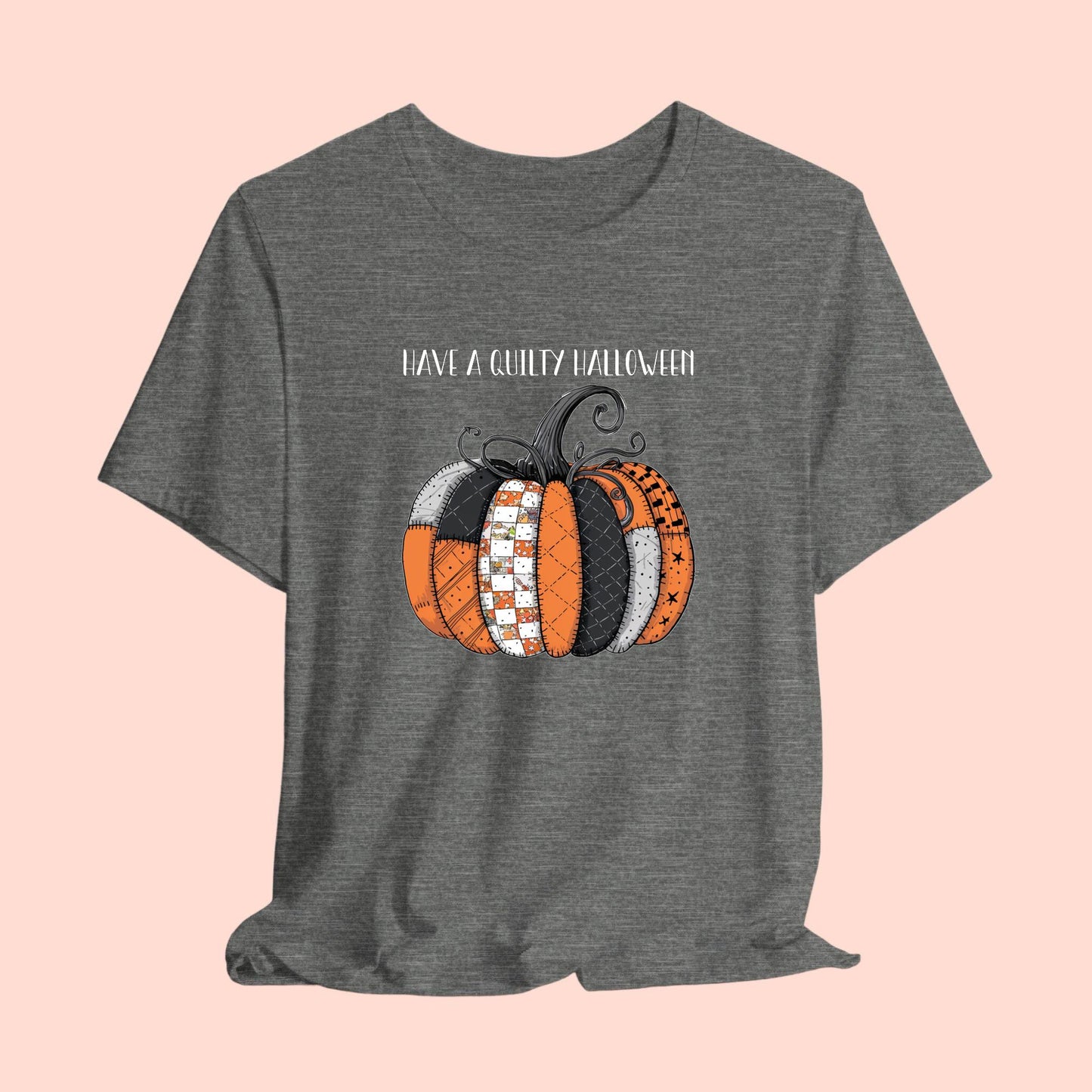 A Halloween Quilting T-Shirt featuring patchwork pumpkin with various quilt patterns. Mix of Halloween and traditional quilt motifs. Intricate stitching details. Text reads "Have a Quilty Halloween". Ideal for quilters who love Halloween.