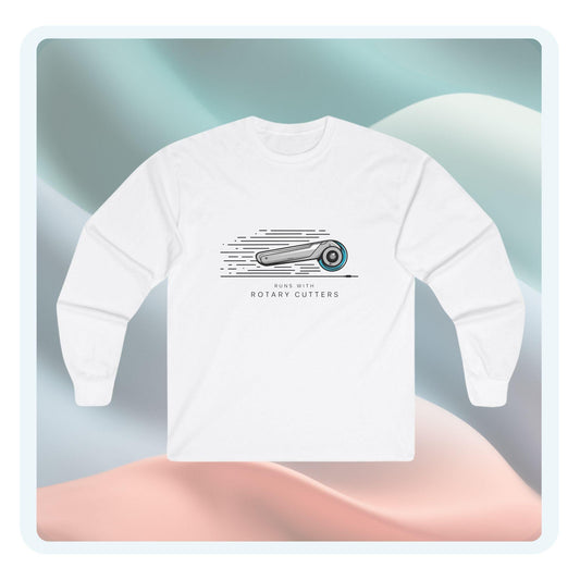 A long-sleeve t-shirt featuring a minimalist design of a rotary cutter in motion and the phrase 'Runs with Rotary Cutters,' ideal for quilters with a playful style