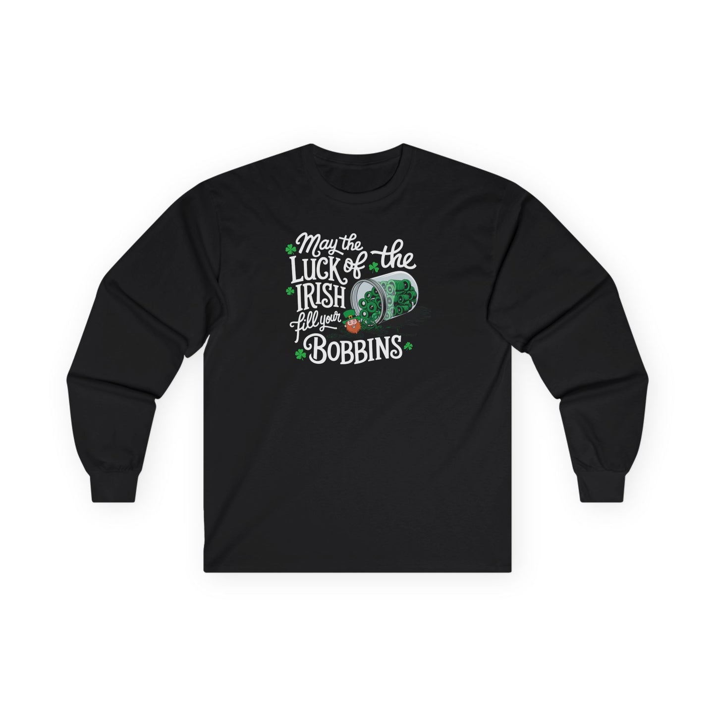 A Black long-sleeve t-shirt featuring a festive design with shamrocks, a spool of green thread, and the phrase 'May the Luck of the Irish Fill Your Bobbins,' perfect for quilters celebrating St. Patrick’s Day.