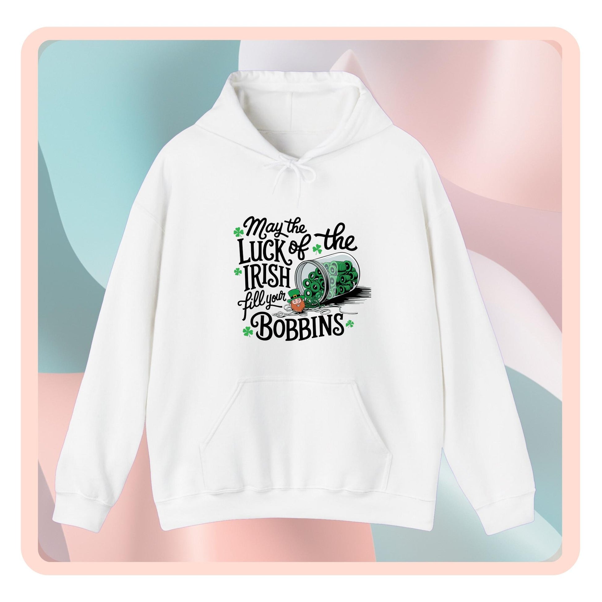 A hoodie featuring a festive design with shamrocks, a spool of green thread, and the phrase 'May the Luck of the Irish Fill Your Bobbins,' perfect for quilters celebrating St. Patrick’s Day.