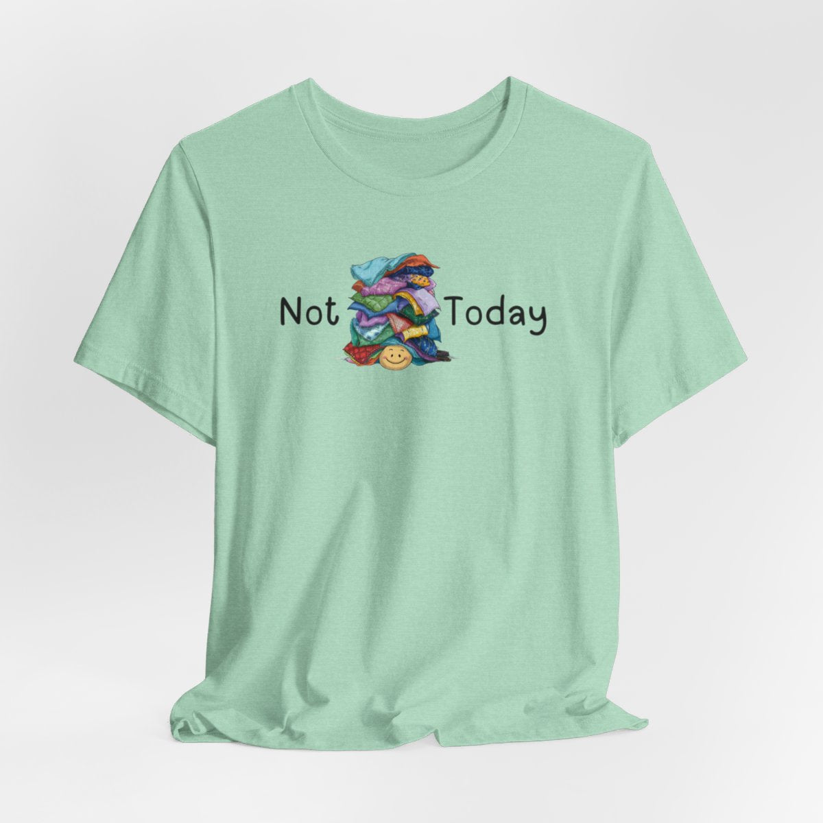 A Heather Mint funny quilting T-Shirt with the phrase Not Today showing an enormous pile of fabric on top of a cheerful quilter