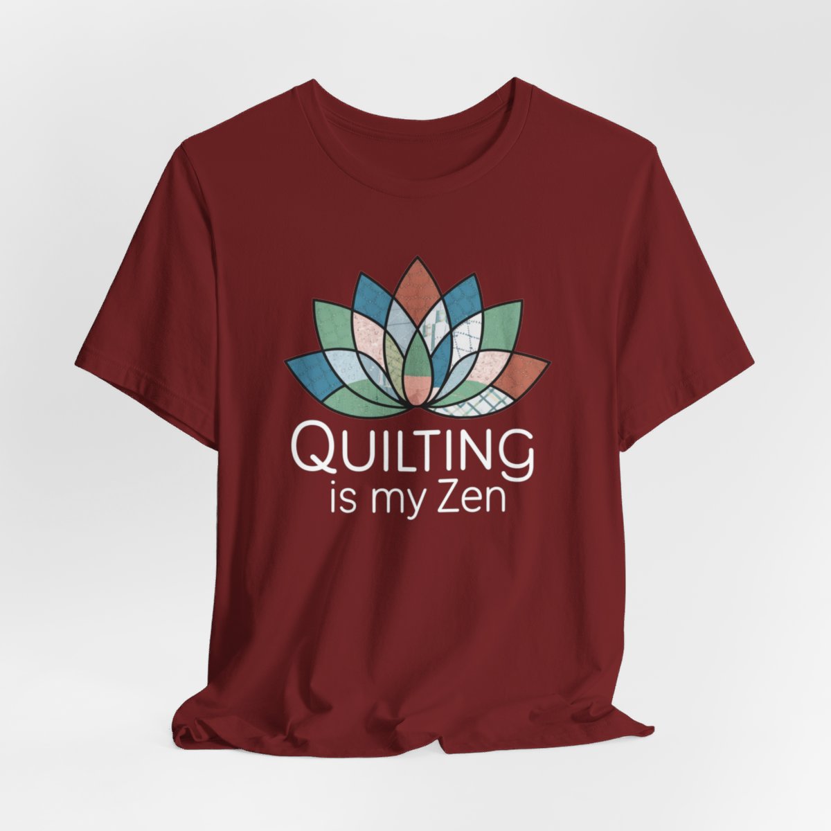 A Cardinal funny quilting T-Shirt with the phrase Quilting is my Zen on a quilting-themed t-shirt with a lotus flower design made of various quilt patterns and textures. 