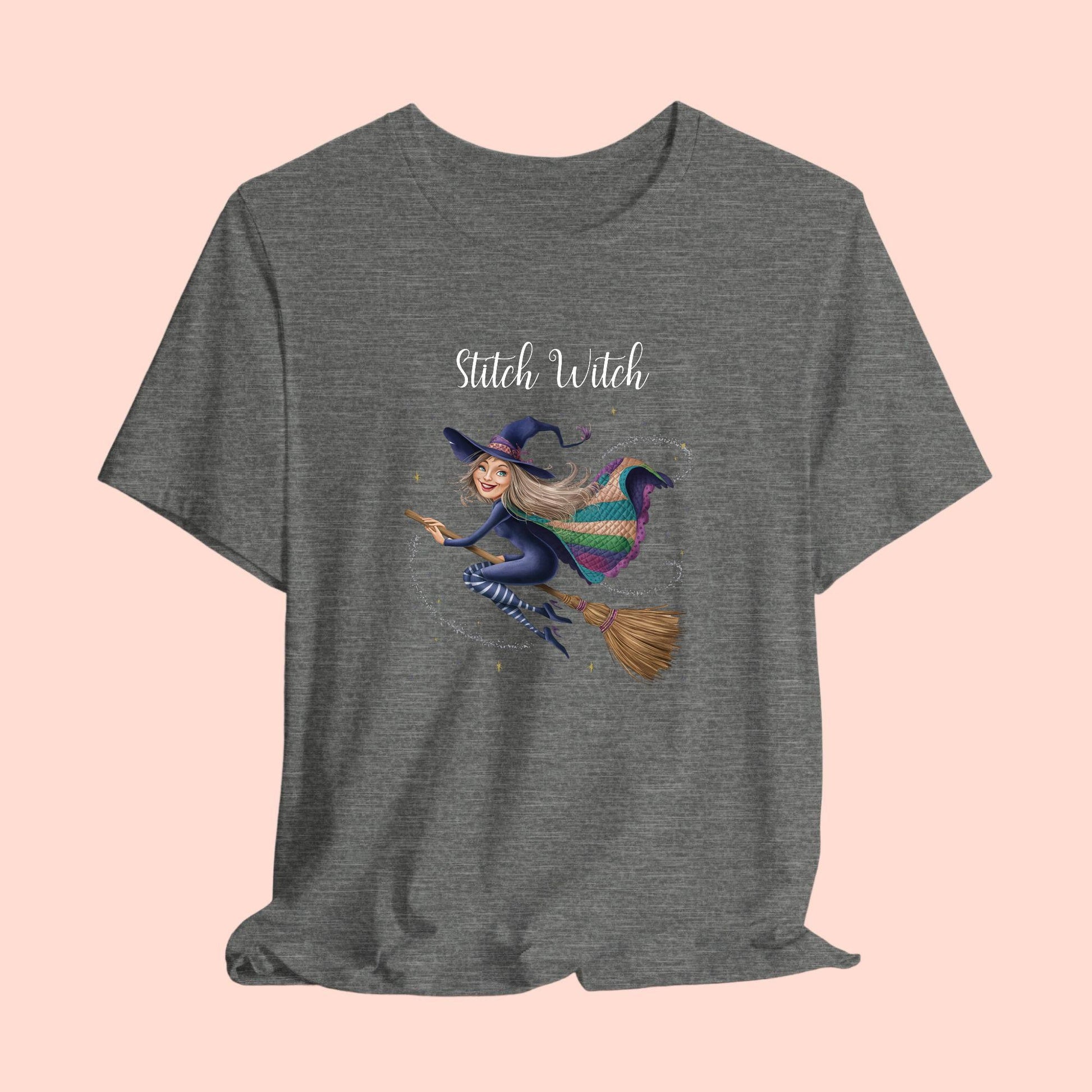 A Halloween Quilting T-Shirt featuring a witch riding broomstick on t-shirt design. Colorful patchwork quilt cape with various patterns. Sparkling magic and stars. Text reads "Stitch Witch". Ideal for quilters who enjoy magical themes.