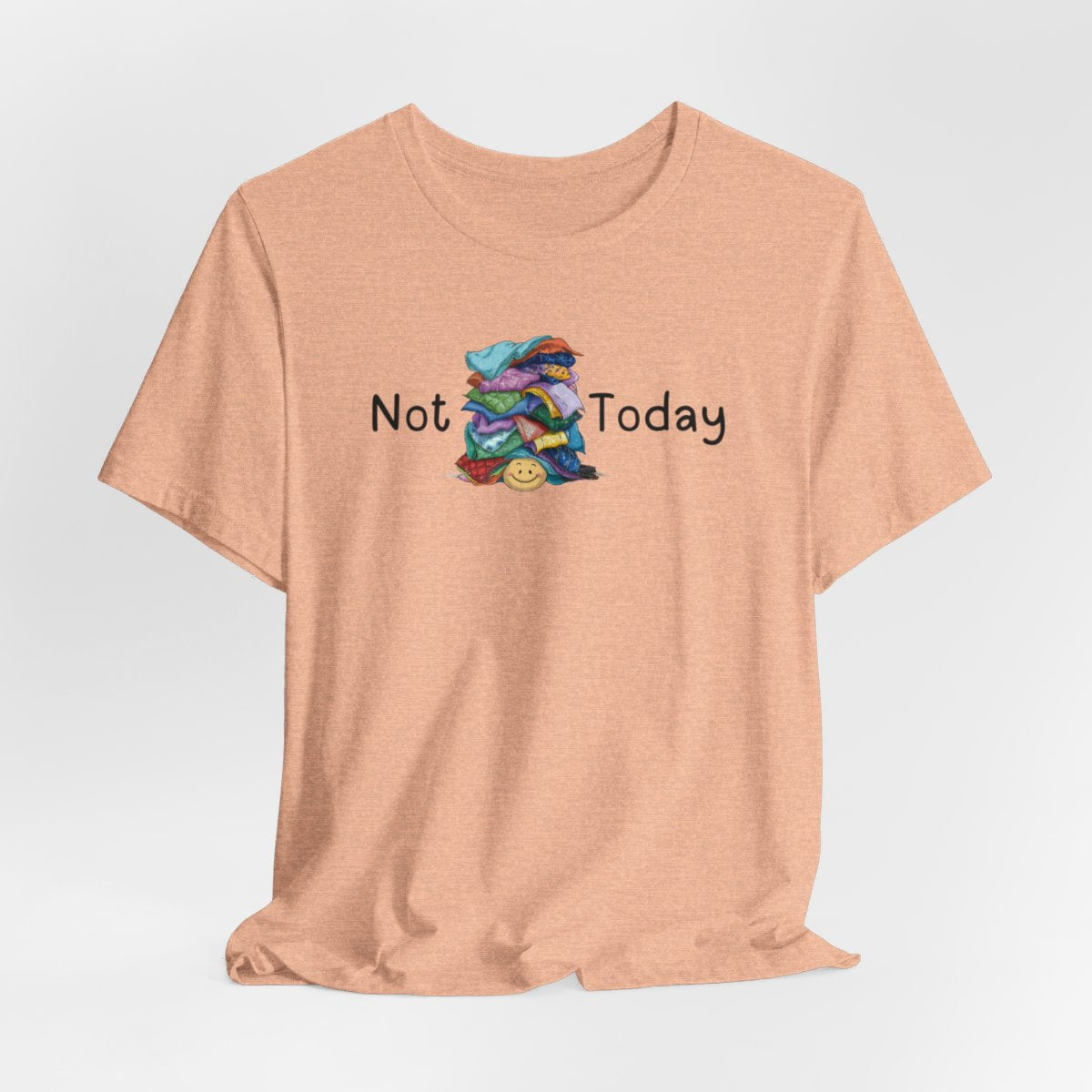 A Heather Peach funny quilting T-Shirt with the phrase Not Today showing an enormous pile of fabric on top of a cheerful quilter