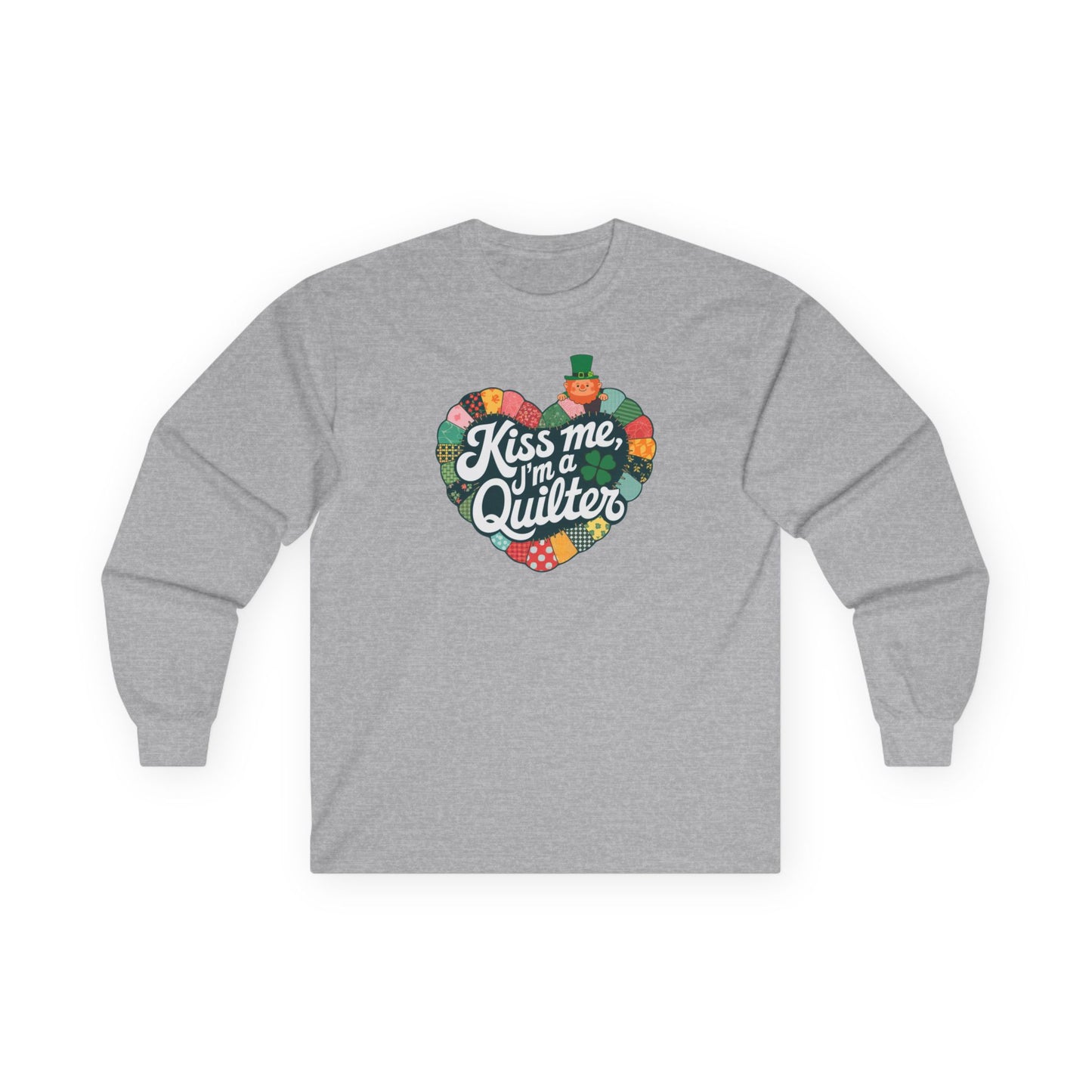 A Sport Grey long-sleeve t-shirt featuring a heart-shaped patchwork quilt design with shamrocks, a leprechaun, and the phrase 'Kiss Me, I’m a Quilter,' perfect for St. Patrick’s Day quilting fun.