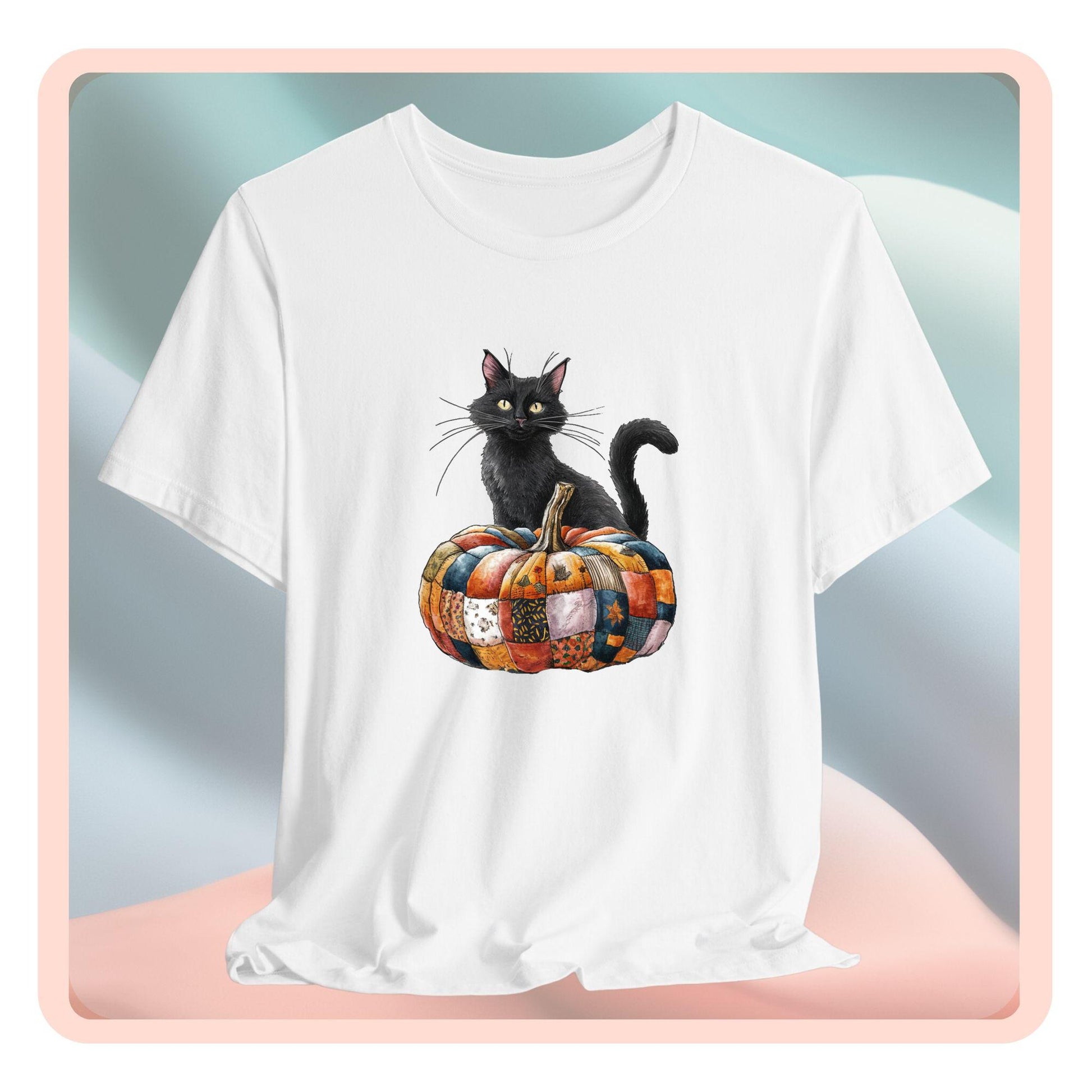 A Halloween Quilting T-Shirt featuring a black cat sitting on colorful patchwork quilt pumpkin. Cat has yellow eyes and long whiskers. Pumpkin features various quilt patterns in autumn colors. Halloween-themed t-shirt design for quilting enthusiasts.