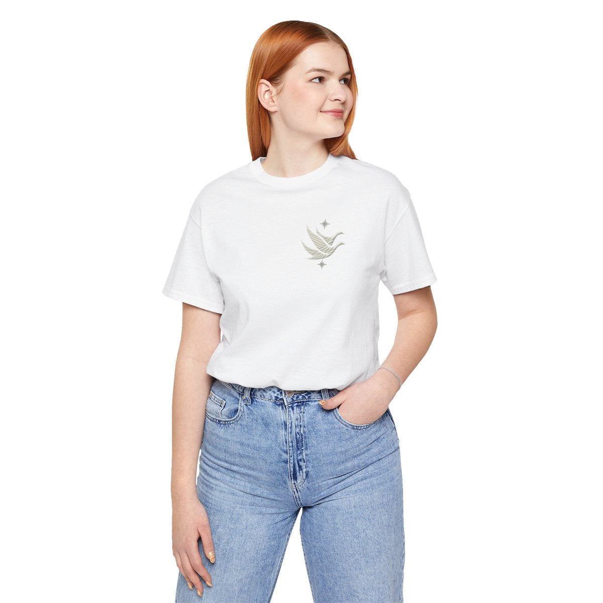 A White T-shirt featuring two stylized white geese in flight, with outstretched wings. The geese are composed of intricate geometric patterns resembling quilt stitching. Two eight-pointed stars frame the scene, one above and one below the geese, adding a celestial element to the peaceful composition.