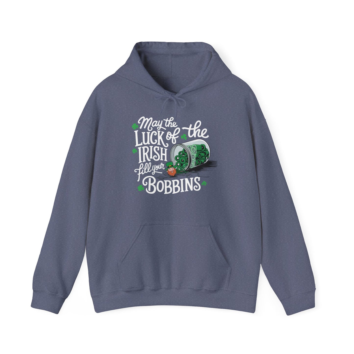 A Heather Navy hoodie featuring a festive design with shamrocks, a spool of green thread, and the phrase 'May the Luck of the Irish Fill Your Bobbins,' perfect for quilters celebrating St. Patrick’s Day.