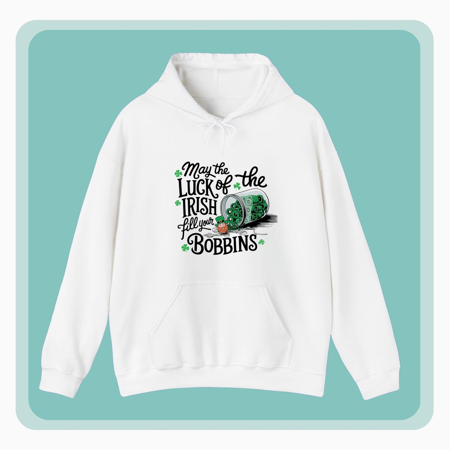 A hoodie featuring a festive design with shamrocks, a spool of green thread, and the phrase 'May the Luck of the Irish Fill Your Bobbins,' perfect for quilters celebrating St. Patrick’s Day.