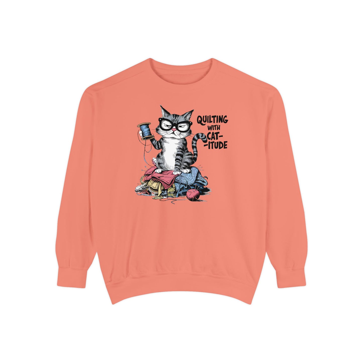 A Terracotta sweatshirt featuring a sassy cartoon cat sitting on a pile of colorful fabric, holding a spool of thread, with the phrase 'Quilting with Cat-itude,' perfect for quilters and cat lovers.