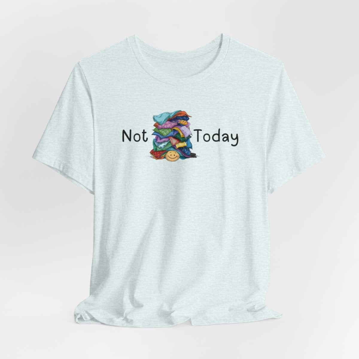 A Heather Ice Blue funny quilting T-Shirt with the phrase Not Today showing an enormous pile of fabric on top of a cheerful quilter