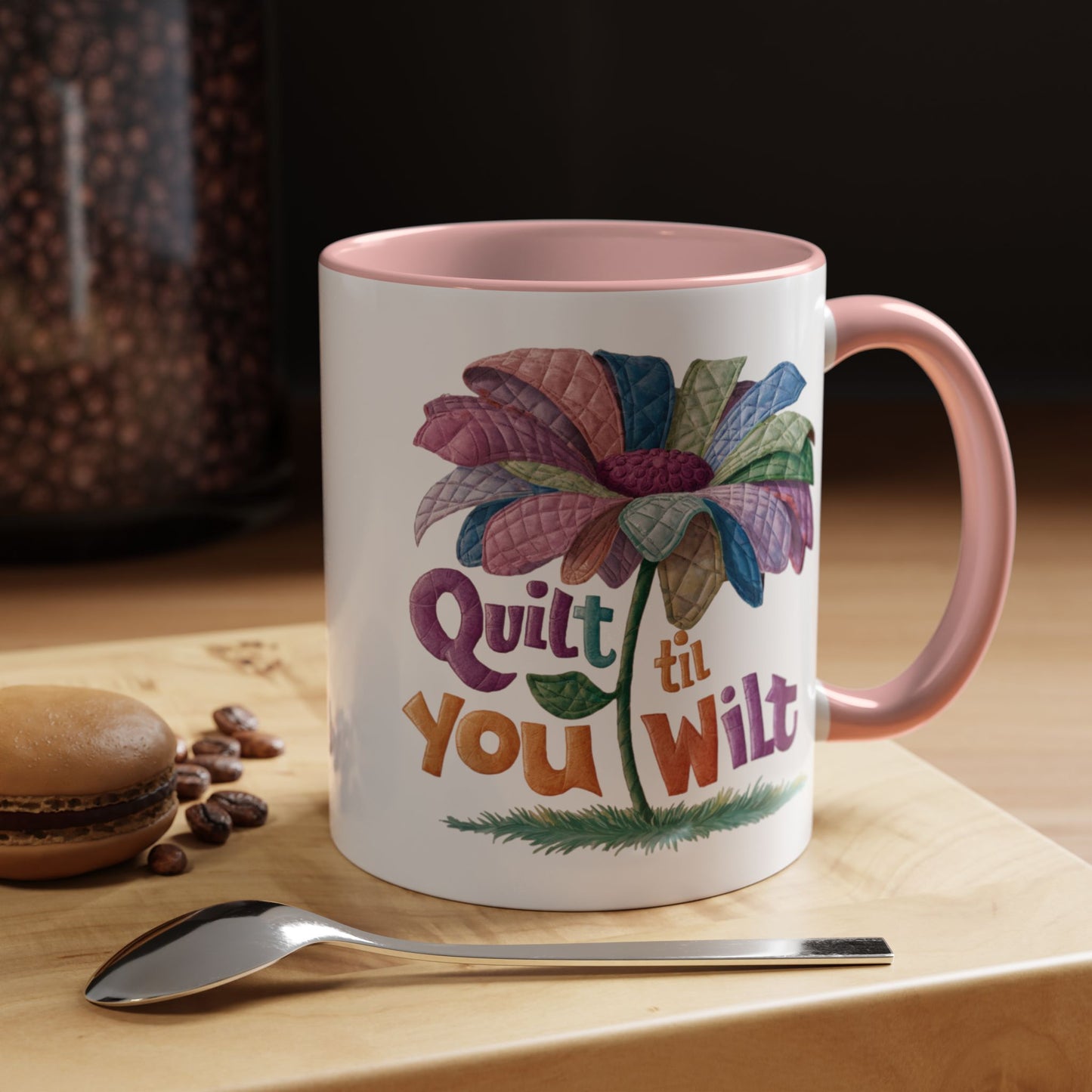 A funny Ceramic Mug with the phrase Quilt 'Till You Wilt showing a cheerful, but slightly wilted quilted flower design