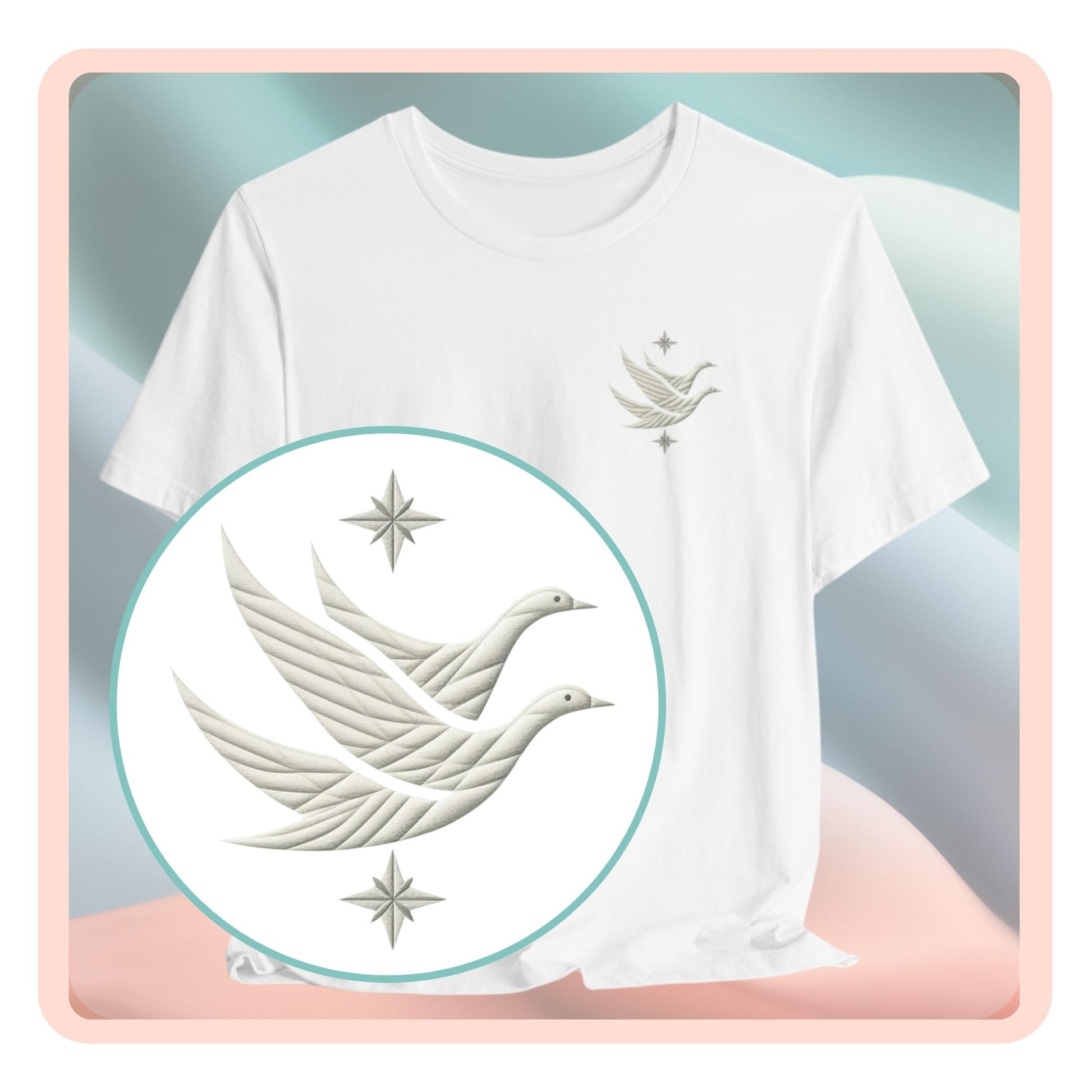 A T-shirt featuring two stylized white geese in flight, with outstretched wings. The geese are composed of intricate geometric patterns resembling quilt stitching. Two eight-pointed stars frame the scene, one above and one below the geese, adding a celestial element to the peaceful composition.