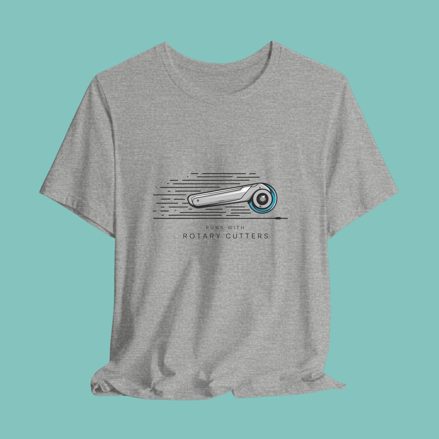 A T-shirt featuring minimalist graphic of a sleek rotary cutter in motion with speed lines. Text below reads "RUNS WITH ROTARY CUTTERS" in a modern font.