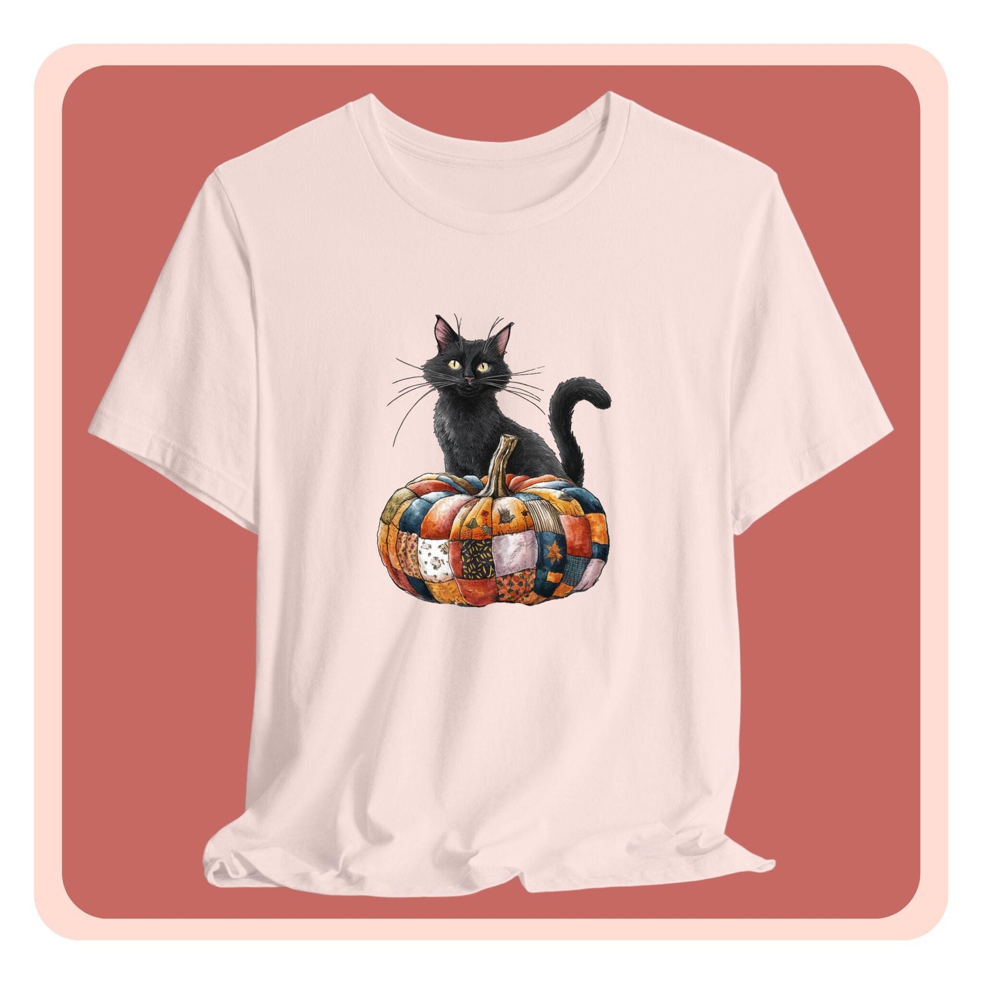 A Halloween Quilting T-Shirt featuring a black cat sitting on colorful patchwork quilt pumpkin. Cat has yellow eyes and long whiskers. Pumpkin features various quilt patterns in autumn colors. Halloween-themed t-shirt design for quilting enthusiasts.