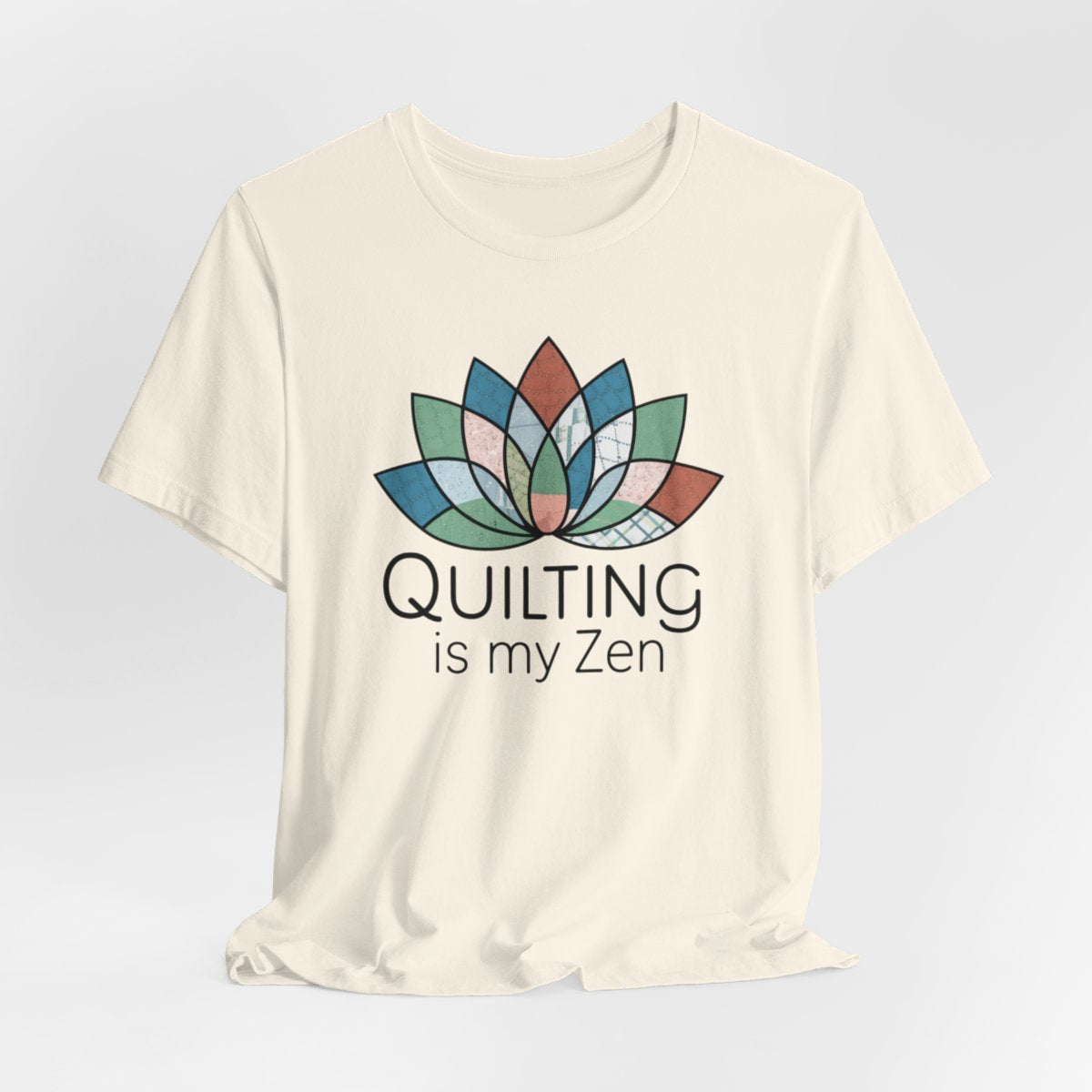 A Natural funny quilting T-Shirt with the phrase Quilting is my Zen on a quilting-themed t-shirt with a lotus flower design made of various quilt patterns and textures. 