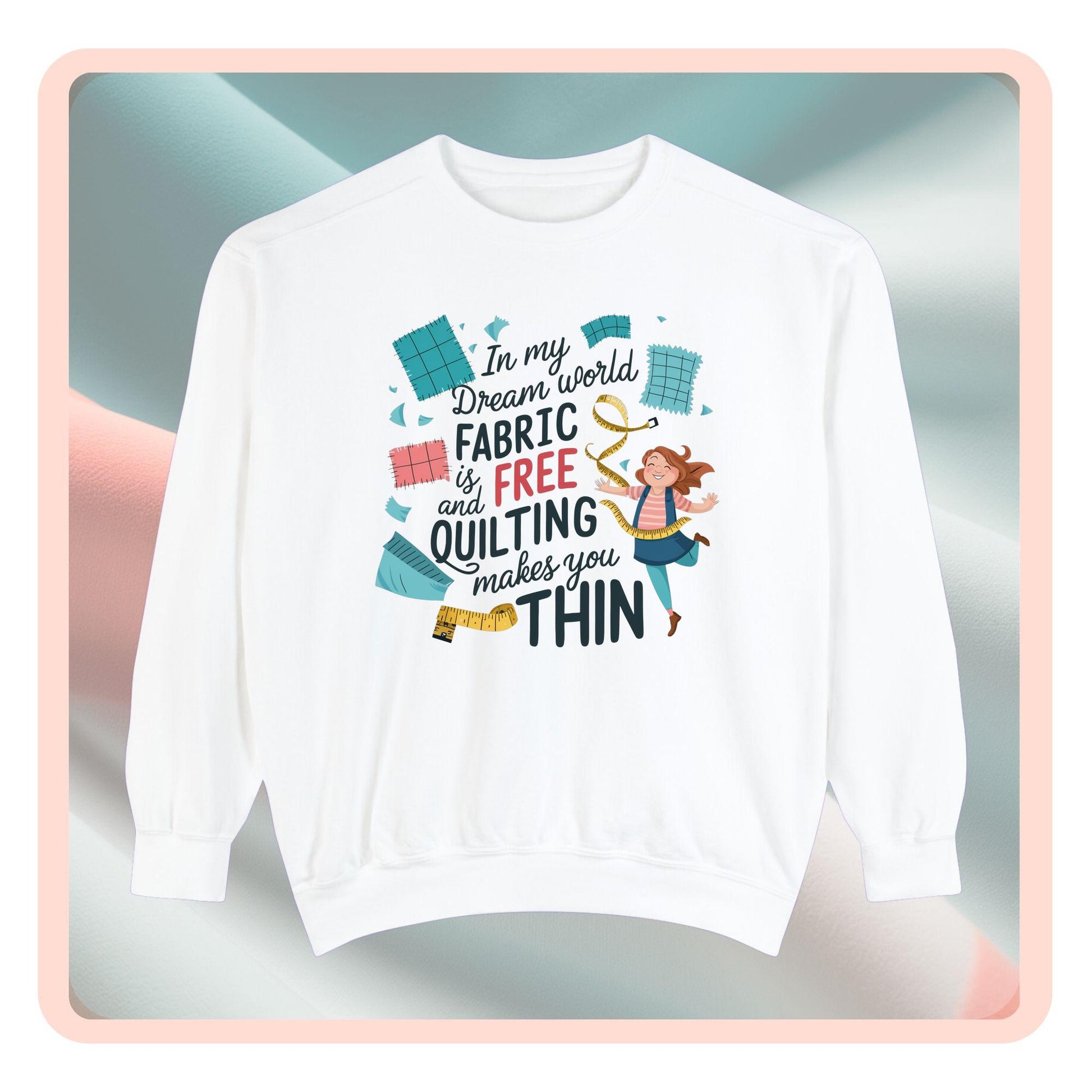 A funny Sweatshirt with the phrase Fabric is Free and Quilting Makes You Thin in font with a cheerful quilter jumping for joy