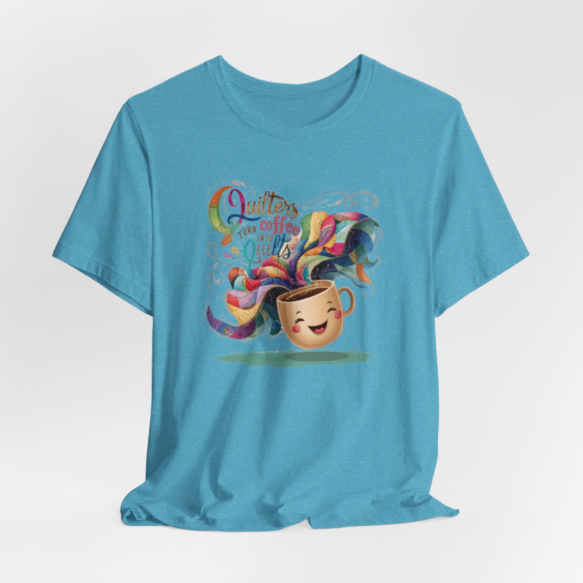 A Heather Aqua funny quilting T-Shirt with the phrase Quilters Turn Coffee Into Quilts showing a fun coffee cup and quilting design