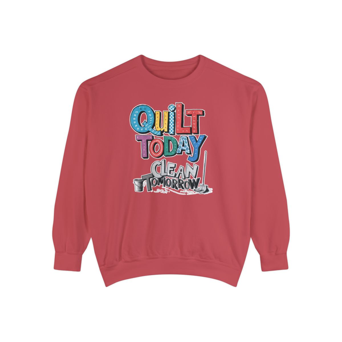 A Crimson funny Sweatshirt with the phrase Quilt Today, Clean Tomorrow in a bold and cheerful font with a broom off to the side