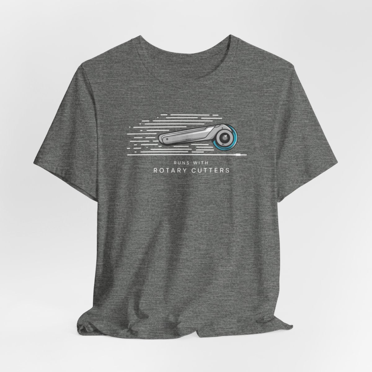 A Deep Heather T-shirt featuring minimalist graphic of a sleek rotary cutter in motion with speed lines. Text below reads "RUNS WITH ROTARY CUTTERS" in a modern font.